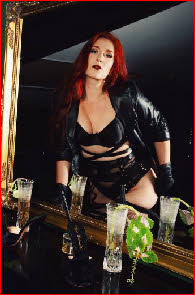 London domme in black latex lingerie