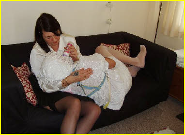 Adult baby bottle fed by dominant lady