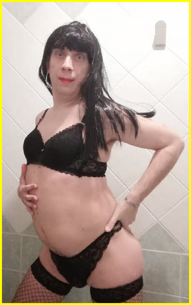 Closet sissy Dania exposed in black bra and knickers