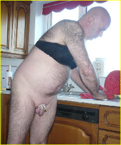 Caged sissy loser Malcolm Carter forced to do the housework wearing a bra Caged sissy loser Malcolm Carter forced to do the housework wearing a bra
