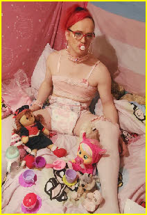 Diaper fag Stephie Lou sucks his dummy while dressed in adult baby attire