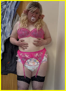 Sissy baby girl Erin wearing stockings, suspenders and a tragic nappy