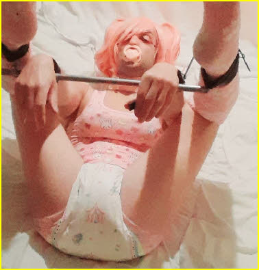 Humiliated ABDL Lily sucks his dummy while trapped in painful bondage