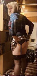 Sissy sub Joanna pulls up his skirt to show off his suspenders Sissy sub Joanna pulls up his skirt to show off his suspenders