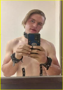 Gay sissy Rikkie wearing leather collar and handcuffs