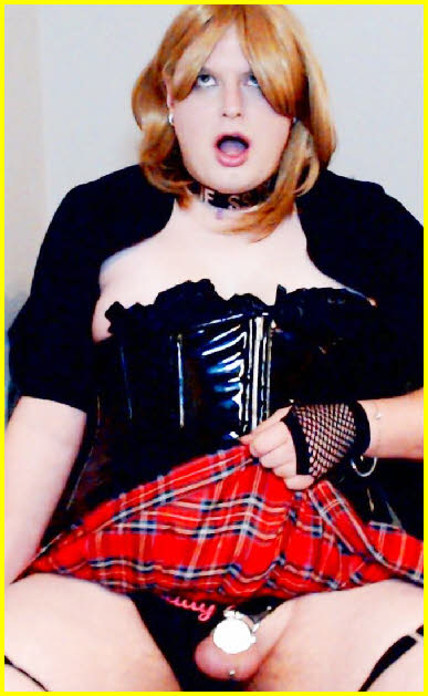 Shamed sissy Jessika hitches up his short skirt to reveal his tiny caged clit Shamed sissy Jessika hitches up his short skirt to reveal his tiny caged clit