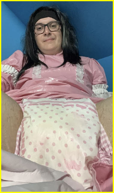 Sissy loser Vinessa dolled up in a pink latex maid uniform and diapers