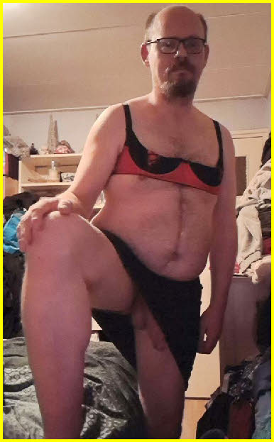 Bearded loser Peggy cross-dressing in bra and miniskirt Bearded loser Peggy cross-dressing in bra and miniskirt