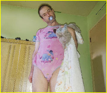 Loser adult baby Kaylie sucking dummy and holding cuddly toy Loser adult baby Kaylie sucking dummy and holding cuddly toy
