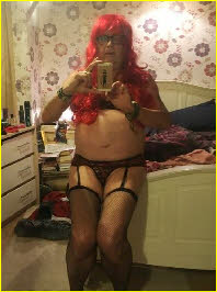 Mincing sissy Charlotte Jayne in black knickers and suspenders