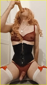 Sex-mad sissy Alicia swallows the tip of a massive dildo