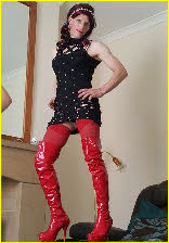Sissy slut in short dress and red latex thigh-boots