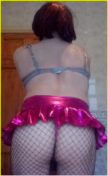Sissy displays tight arse in pink thong and fishnet tights