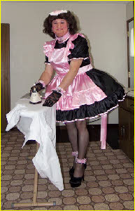 Sissy maid Teri does the ironing in outrageously feminine frock Sissy maid Teri does the ironing in outrageously feminine frock
