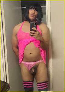 Failed sissy husband Gabriella with tiny cock poking out of pink panties