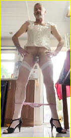 Sissy Simone drops his knickers to expose his caged cock Sissy Simone drops his knickers to expose his caged cock
