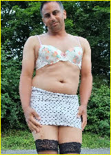 Emasculated sissy Annika forced to parade outside in a miniskirt and stockings