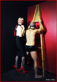 Wigan dominatrix with captive slave