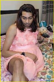 Effeminate ladyboy Maddy in girlie pink frock Effeminate ladyboy Maddy in girlie pink frock