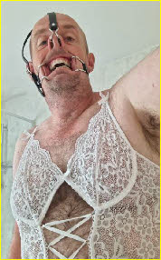 Loser male in lingerie wearing painful nose and mouth gag Loser male in lingerie wearing painful nose and mouth gag