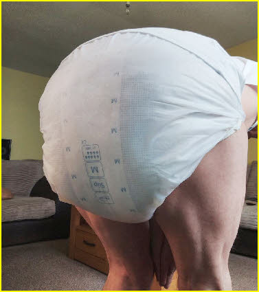 Adult baby loves to soil his thick diapers