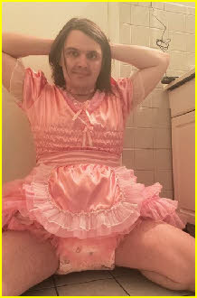 Sissy Pampers wearing nappy beneath his frilly pink frock