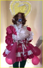 Mincing sissy in outrageously frilly fairy frock